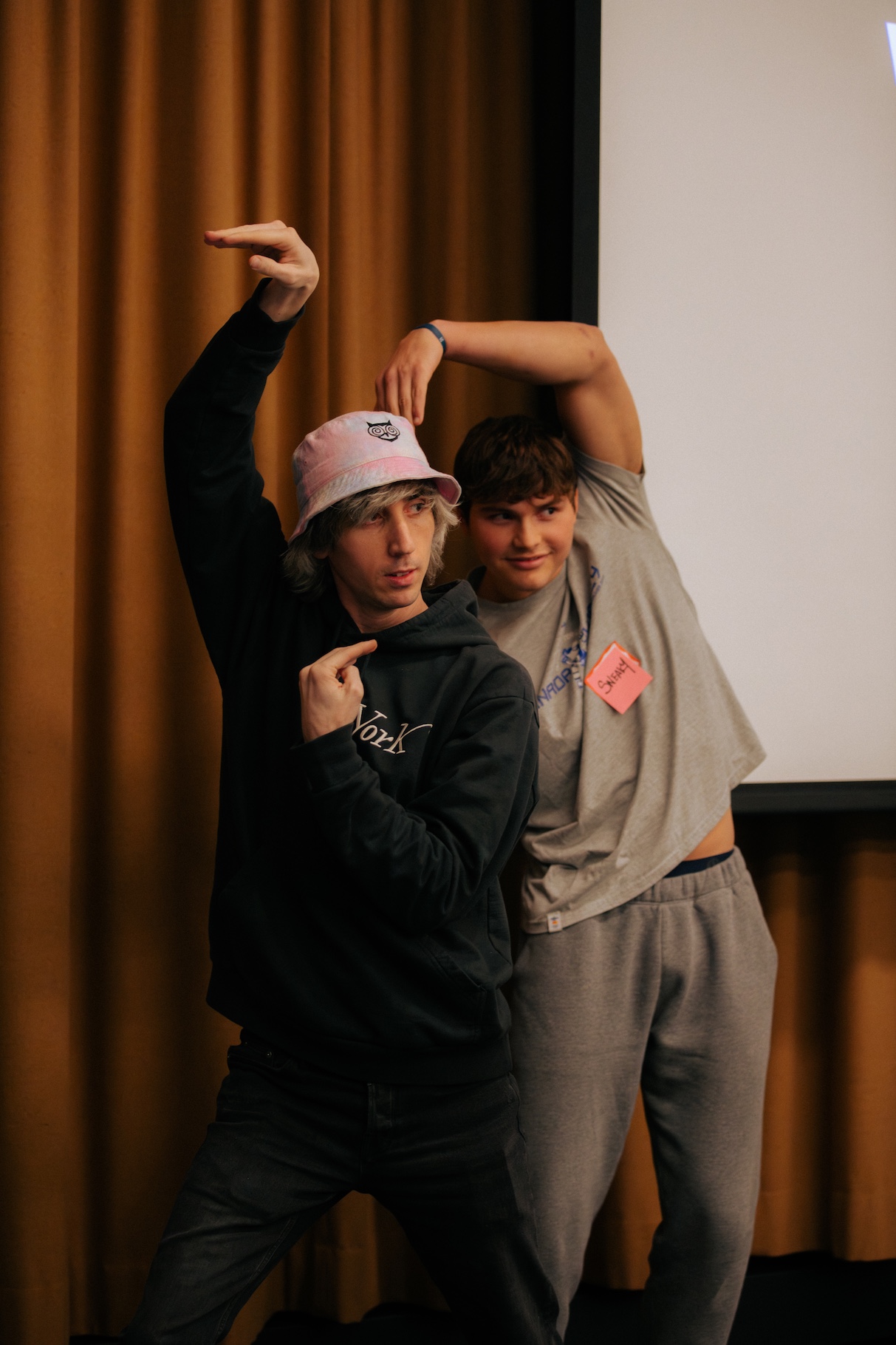 two men dancing as part of their presentation